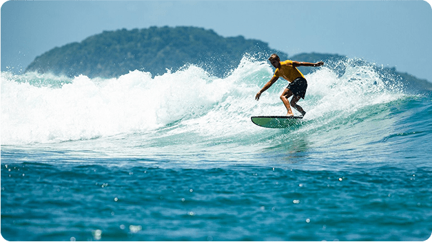 Surfer riding wave
